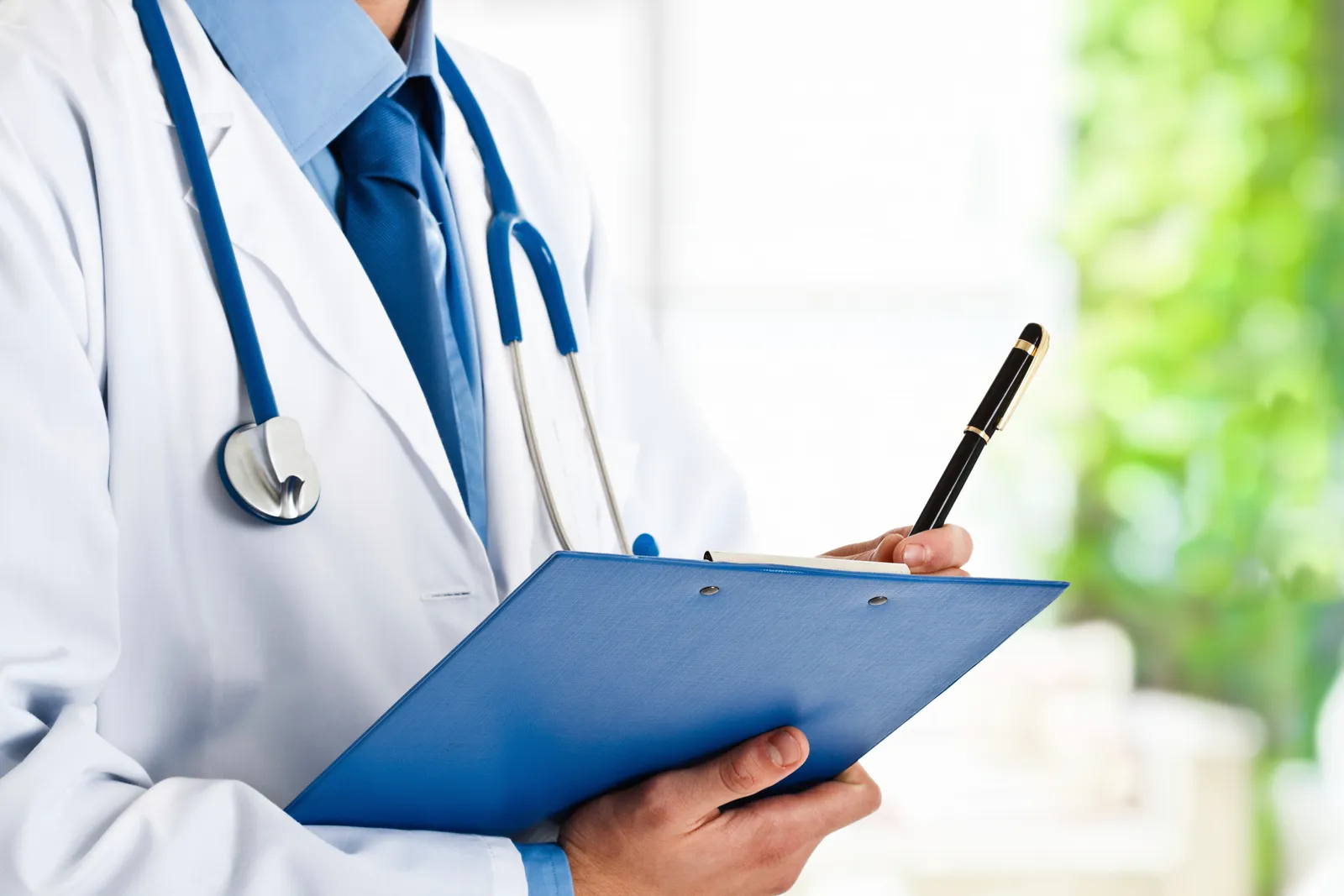 Doctor holding a clipboard — NEODIX medical billing support